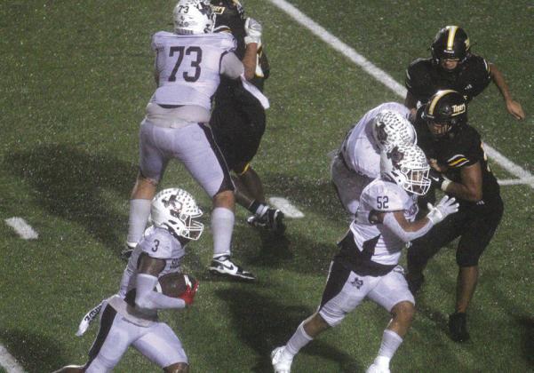 Jonah Brown looks for running room after he took over at running back in the second half against Sealy.Xander Horton (73),Oscar Perez (52), an known Tiger and Maddox Shields (60) look for someone to block. Danny Reneau photo