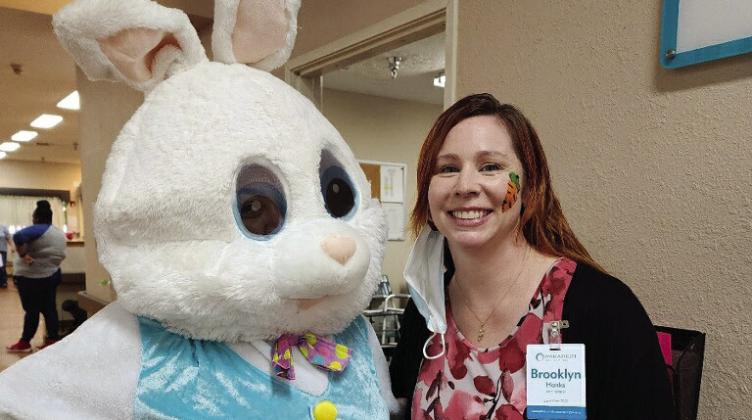 Brooklyn Hanks Johnson,Administrator of Paradigm at the Pines in Silsbee, poses for a quick picture with the Easter bunny during a visit to the facility.