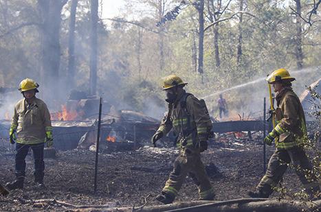 Silsbee and Kountze firefighters went to the 5200 block of Airline Road last Wednesday afternoon where fire had burned an unoccupied trailer house and had spread to trees nearby. Dan Eakin photo