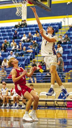 Evadale Rebel Jayden Gravis makes a layup in a game against Bridge City in Evadale on Nov. 28. The Rebels won the game by a score of 61-44.The Rebels were 2-0 for the season after that game. They beat Kelly Catholic 68-53 on Nov. 21. Julie Isbell photo