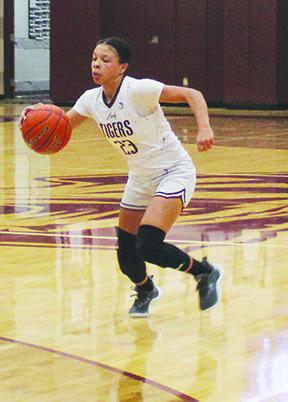 Monica Bottley leads the charge up court as she attempts to get the ball into the front court for Silsbee.Bottley is not only the Tigers leading scorer but she is also an excellent ball handler. Dan Eakin photo