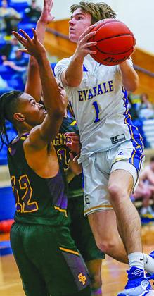 The Evadale Rebels defeated Sabine pass 71-44 in Evadale. Above, Jaden Gravis goes for a layup. Julie Isbell photos