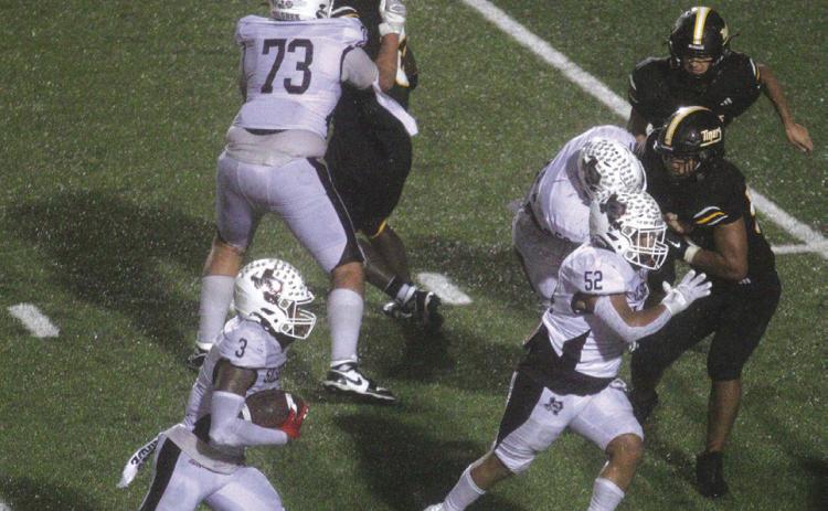 Jonah Brown looks for running room after he took over at running back in the second half against Sealy.Xander Horton (73),Oscar Perez (52), an known Tiger and Maddox Shields (60) look for someone to block. Danny Reneau photo