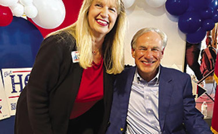 Janis Holt, left, candidate for District 18 state representative, stands with Texas Gov. Greg Abbott in Lumberton where he endorsed her candidacy at a rally last Thursday afternoon.
