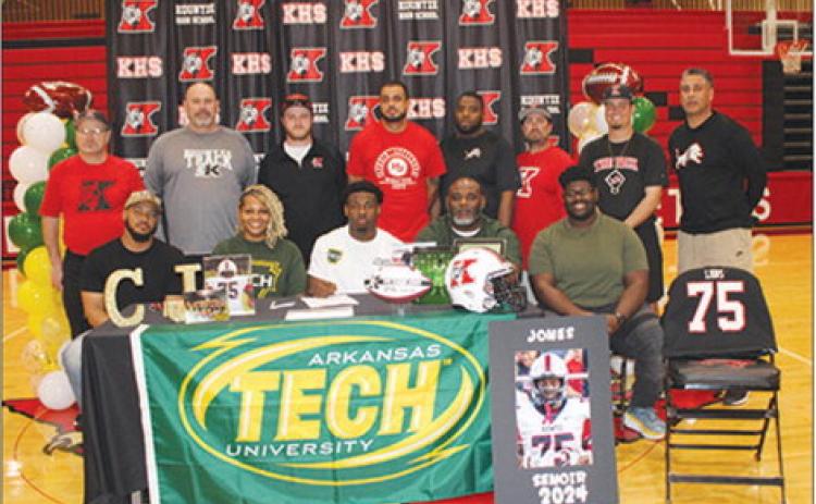 With family members sitting beside him and his coaches standing behind him, Kountze Lion Chase Jones signed Thursday to play football at Arkansas Tech University in Russellville,Arkansas. Dan Eakin photo