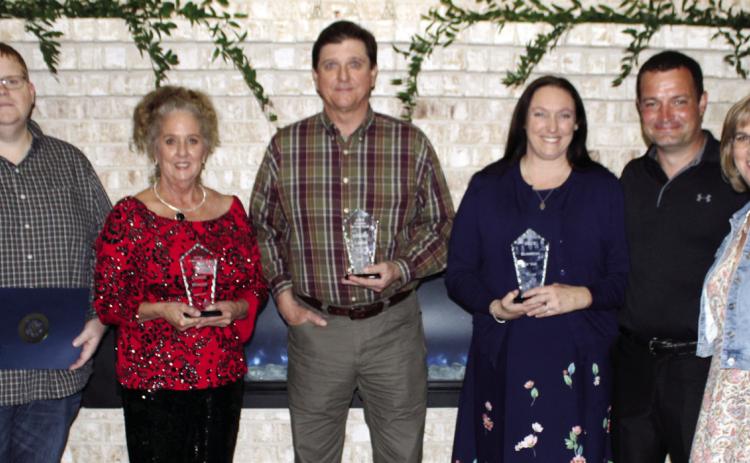 The Kountze Chamber of Commerce presented five awards at the annual banquet last Thursday night. From left are Jason McDonald, Kountze school board member who accepted the Teacher of theYear award for Karen Keys; Connie Winger, winner of the President’s Choice Award; Stuart Laird, Citizen of the Year; and Charles and Pamela Edmonds, owners of Isidore Farms, winner of the Business of the Year award. At right is Donya McLaurin, Kountze chamber president. Dan Eakin photo
