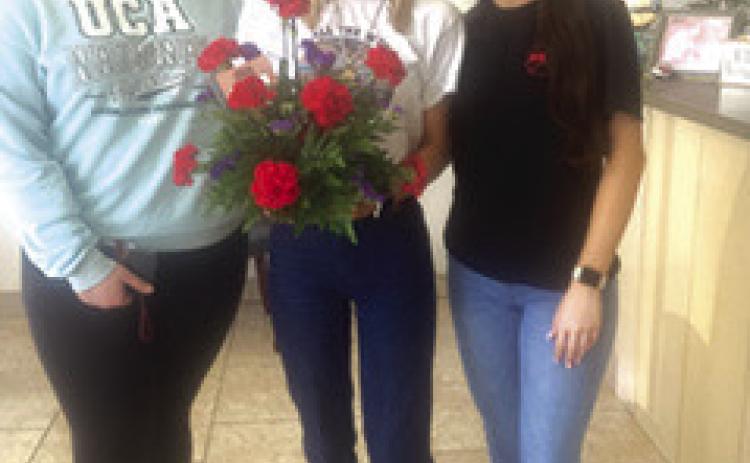 Members of the Tiger Lily, Silsbee High School Floral Department students, came by The Bee office last week to present the newspaper with one of their floral projects. From left are sophomore Madison Konstantine,senior Heather Mc-Millan and junior Fatijana Bela.The girls are in the process of completing levels of the floral program. Courtesy Photo