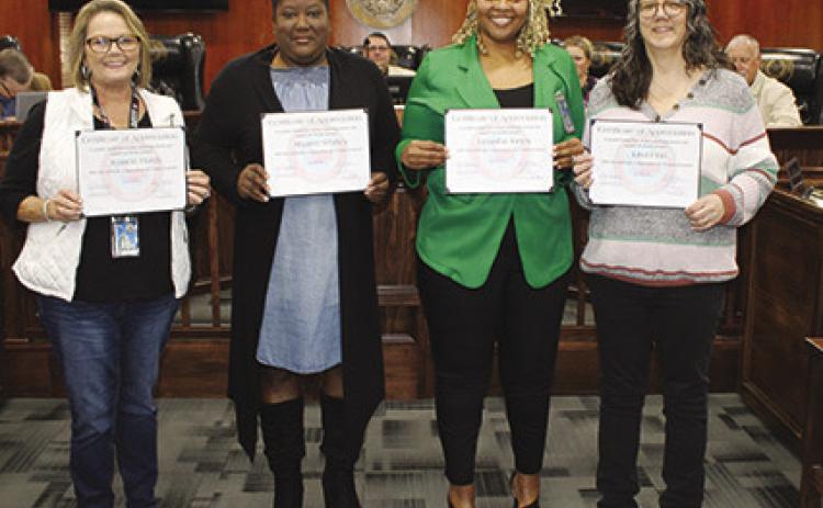 Hardin County employees were honored for lengthy service at a regular meeting of the Hardin County Commissioners Court Tuesday morning. From left are Jeannie Hardy, R&amp;B, five years of service; Shannon Whitley, Health Services Department, 10 years of service; LeTasha Jones, Health Services Department, 15 years of service; and Lisa Finn, 25 years of service. Not shown is Betty Jo Hinson, County Clerk’s Office, 10 years of service. Dan Eakin photo